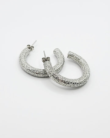 Modernūs faktūrinio rašto apvalūs auskarai