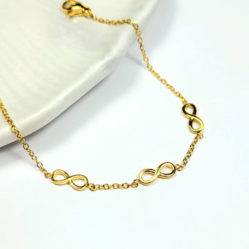 Subtili aukso spalvos apyrankė su begalybės simboliais